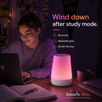 SnoozTo Glow beside a student during a nighttime study and wind-down routine